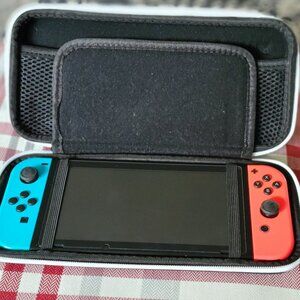 Nintendo Switch. Comes with case. No charger. Memory Card Included.